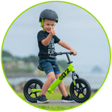 Young Boy on Balance Bike Green Madd